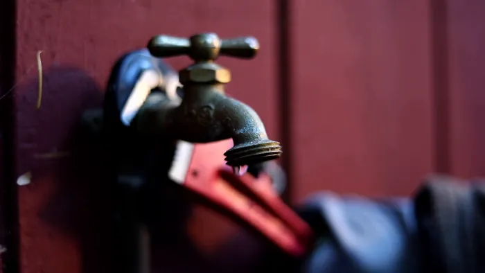 Pipe wrench on an outdoor tap